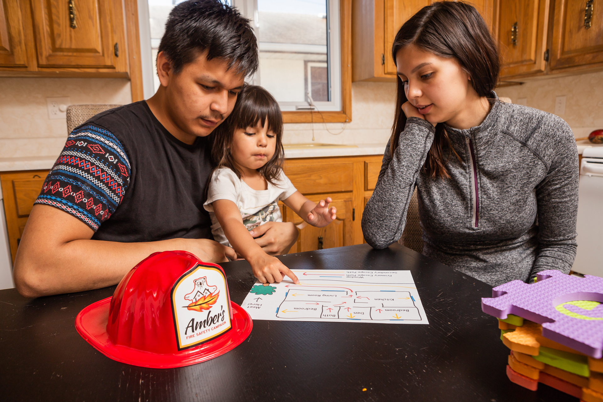 Family teaching child fire safety Image